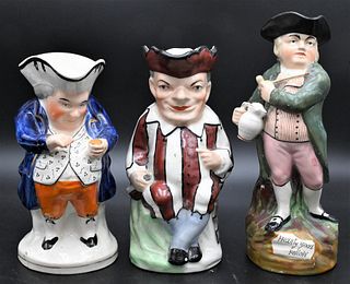 Group of Three Staffordshire Toby Jugs, jester, hearty good fellow, and snuff tanker, tallest 11 1/4 inches.