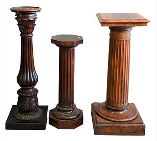 Three Wooden Pedestals, each having fluted shafts, heights 31, 39, and 41 inches.