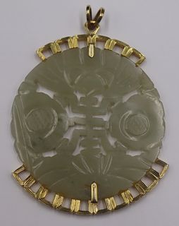JEWELRY. Large 14kt Gold and Carved Jade Pendant.