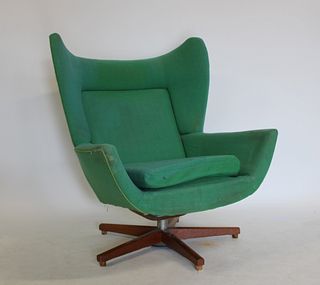 Midcentury Upholstered Wing Back Swivel Chair.
