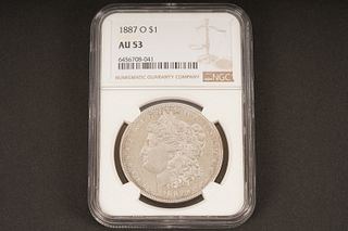 1887 O $1. AU 53. Graded by NGC in sealed coin