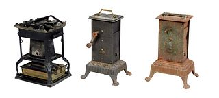 Group of Three French Kitchen Items, 19th c., consisting of two cast iron windup rotisserie, and a folding iron camp stove, Largest rotisserie- H.- 16