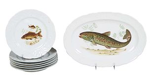 Seven Piece Porcelain Fish Set, 20th c., by CP, France, consisting of six scalloped relief bordered plates with transfer fish decoration, and a matchi