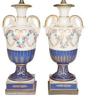 Pair of Continental Style Ceramic Handled Baluster Urn Lamps, with gilt and floral garland decoration over a gilt decorated socle, on an integral squa