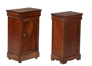 Two French Provincial Louis Philippe Carved Walnut Nightstands, 19th c., the rounded corner top over a frieze drawer and a long cupboard door, on a pl