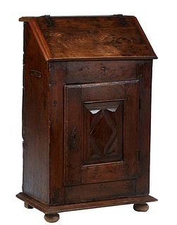 French Provincial Louis XIII Style Carved Oak Desk/Lectern, 19th c., the slant lid top with wrought iron strap hinges, opening to storage, above a cup