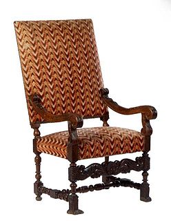 French Henri II Style Carved Oak Fauteuil a la Reine, early 20th c., the canted rectangular cushioned back over leaf and berry carved scrolled arms an