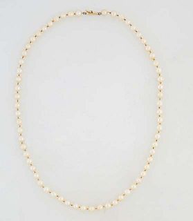 Graduated Strand of Cream Colored Pearls, ranging from 6mm to 7mm, with an 18K yellow gold clasp, L.- 20 1/2 in.