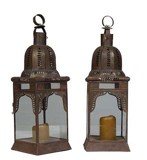Pair of Moroccan Pierced Iron Candle Lanterns, 20th c., the domed top over four glazed sides, one opening, on a pierced flared square base, H,- 26 in.