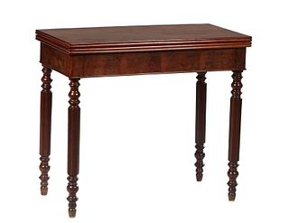 French Louis Philippe Carved Walnut Games Table, 19th c., the reeded edge top opening to a green baize lined gaming surface, on turned tapered reeded 