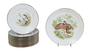 French Thirteen Piece Limoges Porcelain Game Bird Set, 20th c., by Saint Eloi, consisting of twelve circular plates with gilt rims and transfer decora