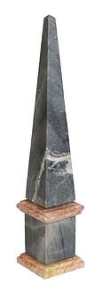 Figured Grey Marble Obelisk, 20th c., on a stepped ocher marble plinth, H.- 20 1/2 in., W.- 3 1/2 in., D.- 3 1/4 in.