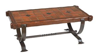 French Provincial Carved Oak and Wrought Iron Tile Top Coffee Table, 20th c., the inset red ceramic tile top on wide U-form supports to splayed paw fe