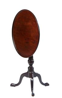English Carved Mahogany Queen Anne Style Tilt Top Tea Table, 19th c., the dished circular top on a turned tapered cylindrical support to tripodal legs