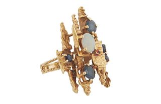 18K Yellow Gold Abstract Ring, the top with a central cabochon oval opal flanked by two oval blue sapphires and three round blue sapphires, on a split