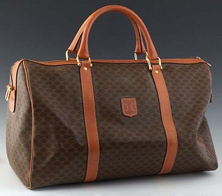 Celine Vintage Boston 45 Travel Bag, in a brown macadam coated canvas, with tan leather and golden brass hardware, with a brown canvas lined interior,