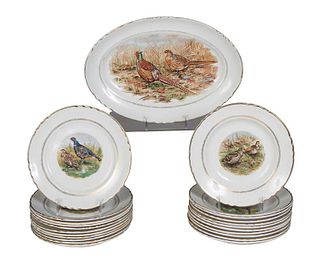Twenty-Three Piece French Porcelain Game Bird Dinner Set, 20th c., with scalloped gilt rims over a gilt tracery band, around a transfer decoration of 