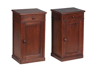 Pair of French Provincial Louis Philippe Carved Walnut Nightstands, 19th c., the rectangular top over a frieze drawer above a long cupboard door, on a