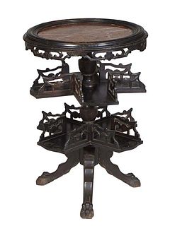 Unusual French Ebonized Marble Top Table, c. 1880, the inset highly figured circular rouge marble over a pierced skirt, on a turned tapered support wi