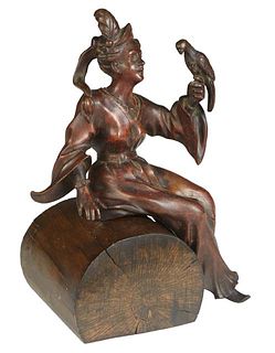 Patinated Bronze Seated Woman with Parrot, 20th c., on a wooden log, H.- 10 1/2 in., W.- 7 1/2 in., D.- 4 1/2 in.