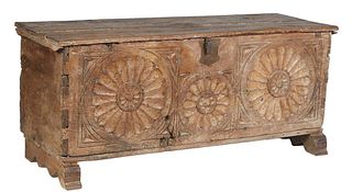 Exceptional French Provincial Renaissance Style Carved Oak Coffer, 18th c., the two board top over a large floral carved front panel, on trestle block