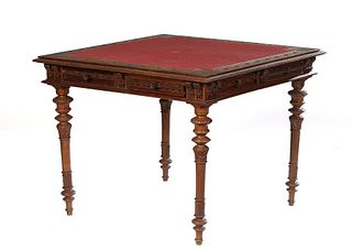 French Provincial Henri II Style Carved Walnut Gaming Table, c. 1880, the stepped top with a floral and incise carved border around an inset red leath