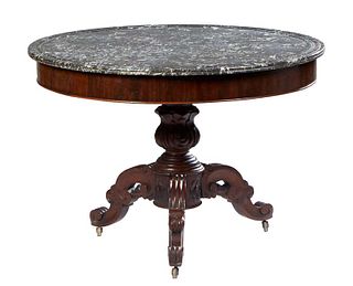French Carved Walnut Marble Top Center Table, c. 1870, the reeded edge highly figured gray marble over a wide skirt, on a turned tapered urn support t