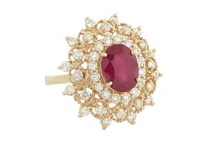 Lady's 14K Yellow Gold Dinner Ring, with a center oval 3.99 ct. ruby atop a border of round diamonds, above a pierced outer border of round diamonds s