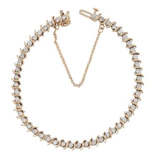 14K Yellow Gold and Diamond Link Bracelet, each of the 50 links with graduated round diamonds, ranging from .03 to .07 cts., with a safety chain. Tota