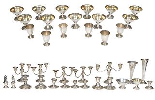 Group of Thirty-Seven Pieces of Weighted Silver, consisting of six liqueur cups; two trumpet vases; two pair of three light candelabra; nine low candl