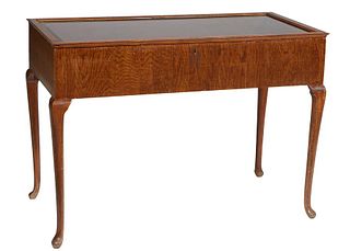 English Carved Oak Lift Top Display Table, early 20th c., the wide beveled glazed top hinged at the rear, on cabriole legs with pad feet, H.- 34 5/8 i