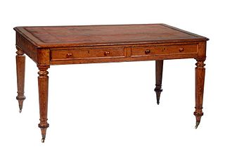 English Carved Oak Partner's Writing Table, c. 1890, the stepped canted corner top over two frieze drawers on each long side, on turned tapered cylind