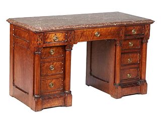 Unusual American Carved Walnut Marble Top Desk, c. 1900. the stepped sloping edge highly figured brown marble over a center frieze drawer flanked by t