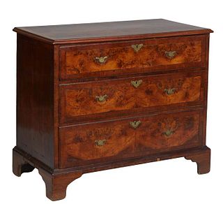 English Georgian Mahogany Inlaid Walnut Chest, early 19th c., the ogee edge banded top over three graduated banded drawers, on a plinth base with brac