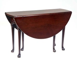 English Carved Mahogany Queen Anne Style Dropleaf Gateleg Dining Table, early 20th c., the circular top over one end drawer, on Queen Anne legs with p