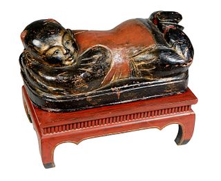 Large Chinese Carved Wooden Reclining Happy Hotei, 19th c., with traces of original gold and black paint, on a later polychromed red wooden stand, Fig