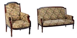 French Louis XVI Style Carved Walnut Two Piece Parlor Suite, late 19th c., consisting of a settee with an arched canted upholstered back to two uphols
