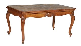 French Louis XV Style Carved Oak Draw Leaf Dining Table, 20th c., the stepped parquetry inlaid rounded corner top over a shell carved scalloped skirt,