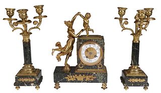 French Diminutive Three Piece Gilt Spelter and Marble Clock Set, 19th c., the highly figured verde antico marble plinth with an enamel dial time and s