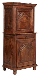 French Provincial Carved Oak Cabinet a Deux Corps, c. 1820, the stepped ogee crown over a fielded panel door with a steel escutcheon and steel fiche h