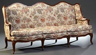 French Carved Beech Louis XV Style Canape, 20th c., the triple arched upholstered back to upholstered wings and arms, on a serpentine base with three 