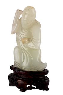 A CHINESE PALE CELADON JADE FIGURE OF A SAGE, QING DYNASTY, 18-19TH CENTURY