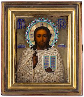 A RUSSIAN ICON OF CHRIST PANTOCRATOR WITH A FILIGREE, GILT SILVER AND ENAMEL OKLAD, MARKED IN SC IN CYRILLIC, 1899-1908