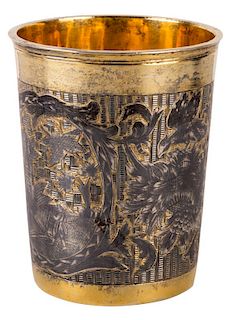 A RUSSIAN GILDED SILVER AND NIELLO BEAKER, MARKED SENIK IN CYRILLIC, MOSCOW, CIRCA 1814