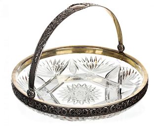 A LARGE RUSSIAN SILVER-MOUNTED CUT-GLASS CAKE BASKET WITH SWING HANDLE, PIOTR BASKAKOV, MOSCOW, 1908-1926