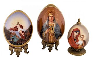 A GROUP OF THREE IMPERIAL PORCELAIN EASTER EGGS WITH RELIGIOUS IMAGERY, IMPERIAL PORCELAIN FACTORY, ST. PETERSBURG