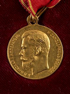 A RARE RUSSIAN GOLD MEDAL AWARDED BY EMPEROR NICHOLAS II FOR ZEAL, ENGRAVED BY VASYUTINSKY, 1894