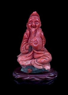 A Red Coral Figure of an Immortal Height 3 3/8 inches.
