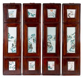 A Set of Four Famille Rose Porcelain Inset Rosewood Panels height overall 41 3/4 x 10 1/2 inches.