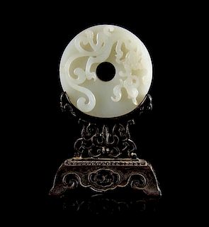 * A White Jade Bi Disk Diameter 2 1/2 inches. Height with stand 4 1/2 inches.